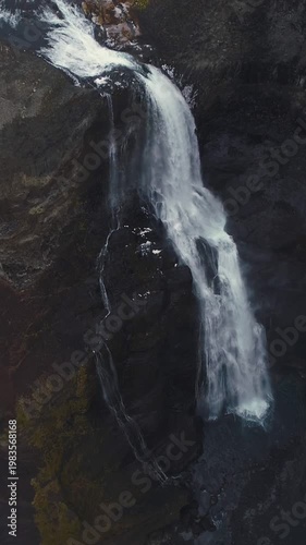 Epic Waterfall in scenic iceland nature, aerial shot - vertical video