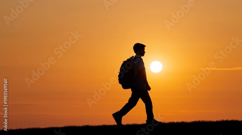Sunset Walk of a Traveler With a Backpack on a Hill