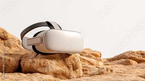 Off White VR Headset on Tan Rocks Against White Background