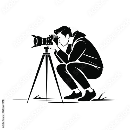 Photographer crouching with camera on tripod, capturing a shot, outdoor setting