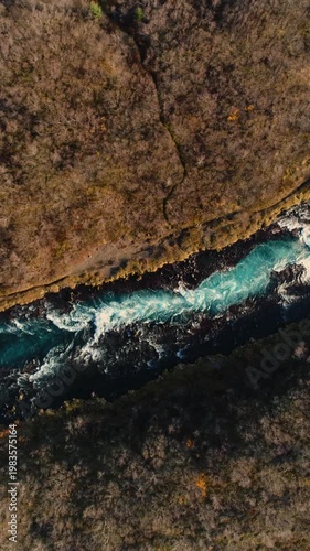 Epic Waterfall in scenic iceland nature, aerial shot - vertical video