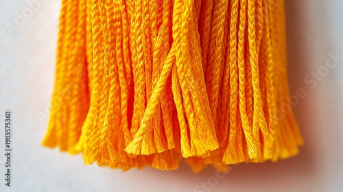 Bright Tassels Hang on Fabric in a Close-Up View During the Daytime