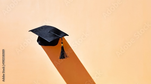 Graduation Cap Placed on a Simple Surface With a Strong Shadow Showing the Ti...