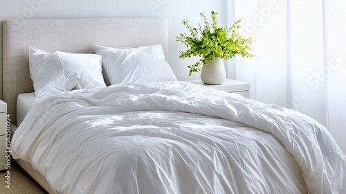 Bright Bedroom With White Bedding and Green Plant on Nightstand Near Window
