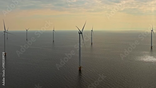 Aerial view of offshore windmill park with blue sky, windmill park in the sea, aerial view of wind turbine, Netherlands