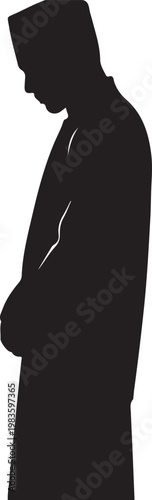 Silhouette of a muslim man standing in a humble prayer position wearing a traditional kufi cap and long islamic robe