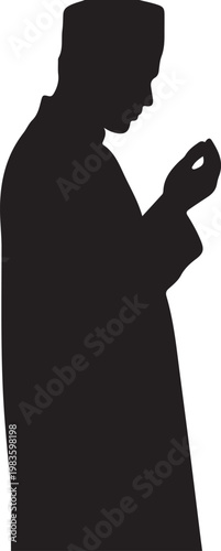 Silhouette of a muslim man praying with hands raised in supplication wearing a traditional kufi cap and long robe