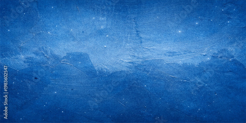 Abstract blue grunge texture suggests a deep cold ocean wave or an old frozen ice surface with white winter snow patterns