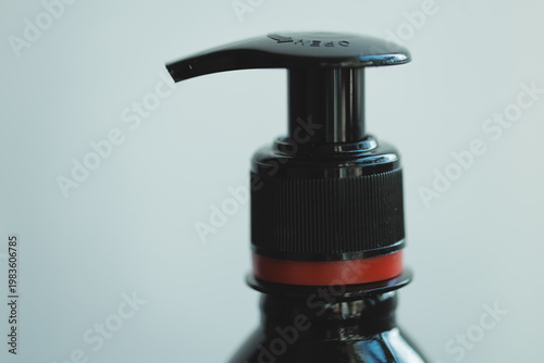 A close-up shot of a bottle filled with a clear liquid