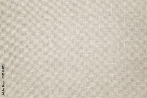 Linen fabric texture background in neutral beige color. Light beige textile background for packaging, design, banner and copy space.