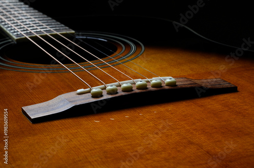 Acoustic guitar bridge closeup