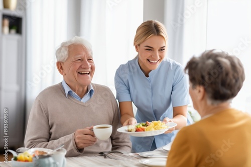 Blonde Caregiver Serving a Hot Meal to a Senior Couple