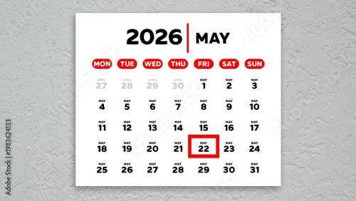 The date May 22nd marked with a red cursor on a wall calendar 2026