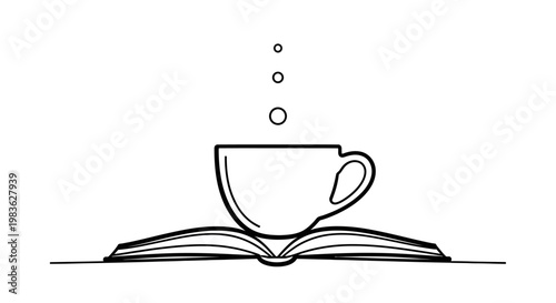 A steaming cup on an open book.