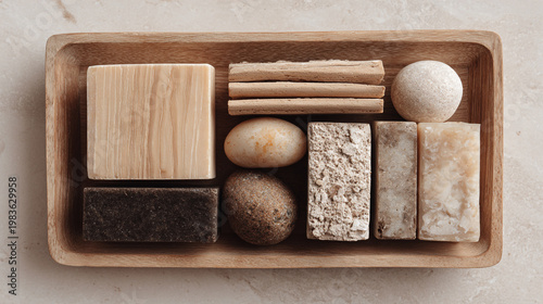 A variety of natural soaps and bath products displayed in a wooden tray