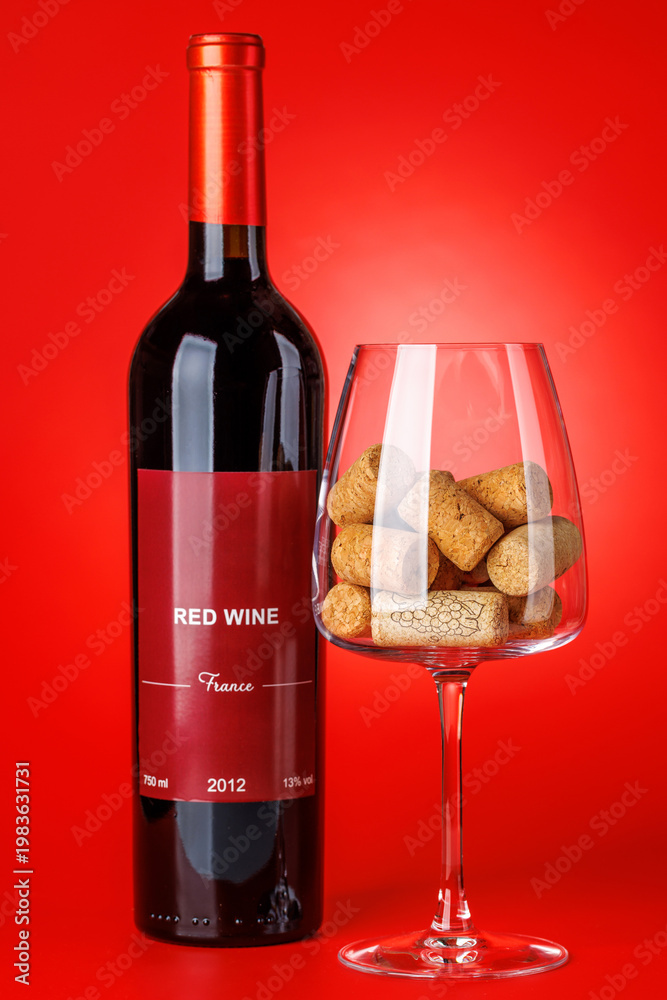 Fototapeta premium Red wine bottle mockup on red background