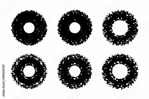 Six rough circular shapes resembling donut holes on a white background