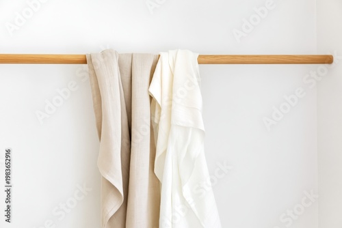 Curtains Hanging on a Wooden Rod in a Bright Indoor Space During the Day