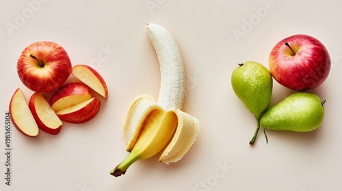 Fresh Fruit Arranged on a Light Surface With Apples, Banana, and Pears in Cle...