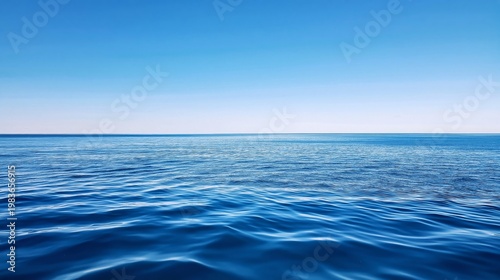 Endless Blue Water Merges With Clear Sky at a Calm Seaside During Daylight Hours