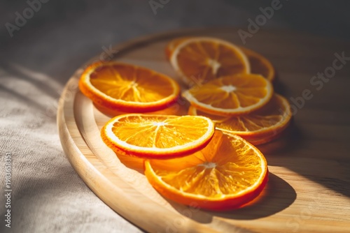 Sliced Oranges Laid out on a Wooden Tray in Bright Light Showing Details of t...