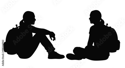 Two individuals seated facing each other a striking black silhouette