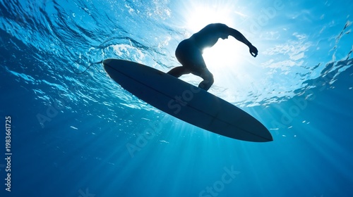 Surfer Rides Wave in Ocean During Sunny Day at Beach With Clear Blue Water an...