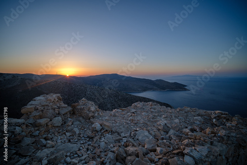 View of a beautiful sunset from the Paleokastro hill in Ios Greece