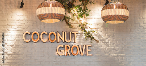 Coconut Grove illuminated wall sign with decorative pendant lights