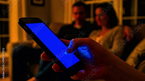 Video: A teenager using a smartphone under parental supervision (blurred effect), social media, rules, games, 