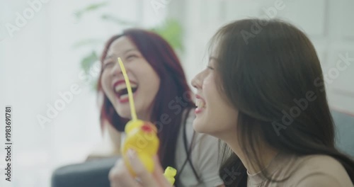 Wallpaper Mural Holiday concept of 4k Resolution. Asian women blowing soap bubbles together inside home. Torontodigital.ca