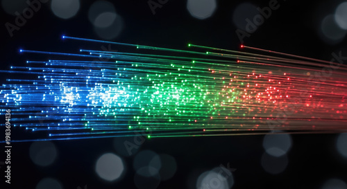 Fiber optic strands glow with vibrant blue green and red light against a dark background with bokeh effect creating a modern technology display