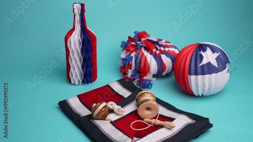 Chilean flag decorations with traditional games like the spinning top and the ball in a cup for fiestas patrias