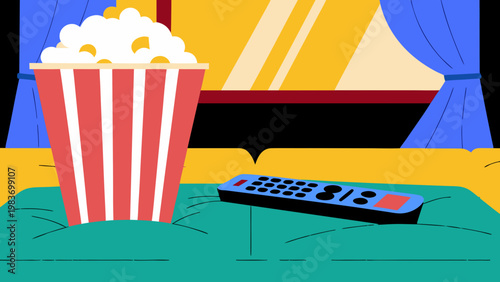 Popcorn bucket and remote control on a teal couch in a cozy living room with curtains and a window, perfect for movie nights at home