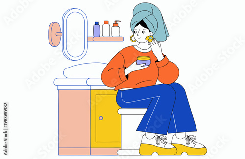 Woman with towel on head applying skincare product while sitting on toilet in a bathroom, colorful shelves with bottles and mirror visible in the background