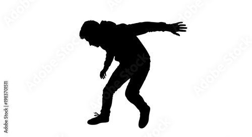 Silhouette of a Person Dancing with Dynamic Pose and Outstretched Arms