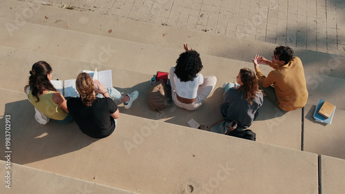 Foto Group Of Students Studying On Outdoor Stairs Together