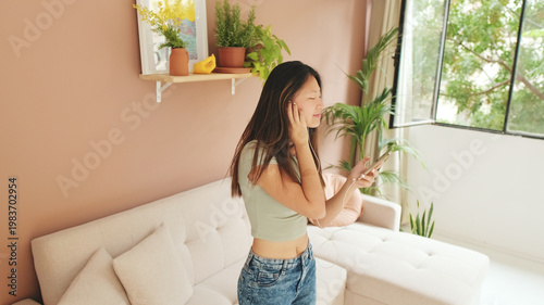 Young Woman Listening to Music at Cozy Home