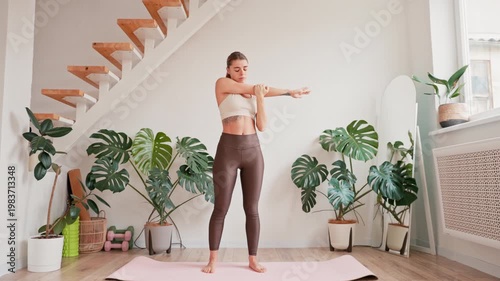 Young Woman Stretching Her Arms During Home Workout