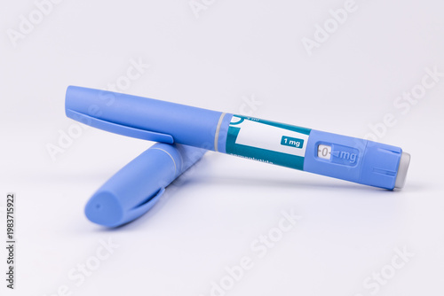 Blue medical pens for glp-1 semaglutide therapy on a white background for illustrating diabetes control and morbid obesity treatment.