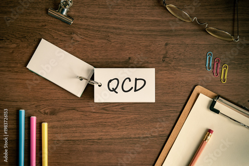 Fotografie Eye-catching image of QCD text on word card