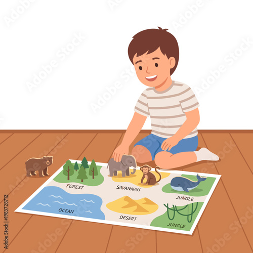 Young boy learning about animal habitats with educational map toy.