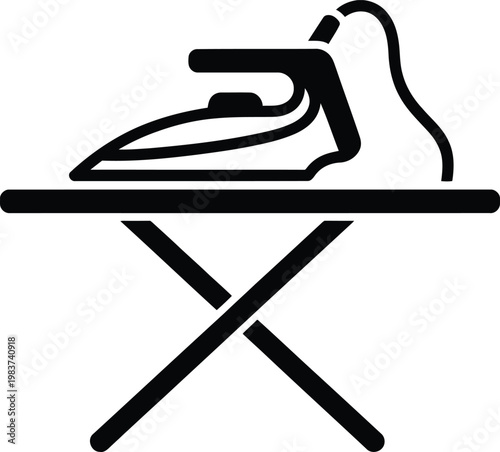 Household clothes iron sitting on an ironing board ready to remove wrinkles from clean laundry garments