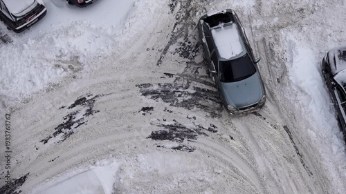 winter parking difficulties residential courtyard snow-covered cars top view neighborhood