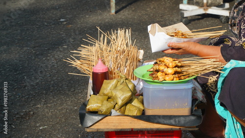 Traditional satay skewers sold by a street vendor in Yogyakarta