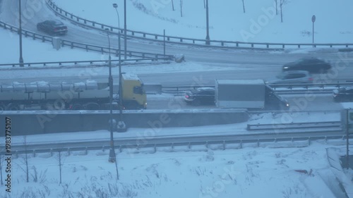 busy highway traffic winter snow urban aerial view vehicles city road