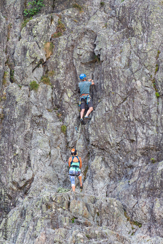 Chamonix-Mont-Blanc, Haute Savoie, France - August 09th, 2025: People climbing Les Gaillands rock, a traditional sporting activity maintained by the Compagnie des Guides de Chamonix.