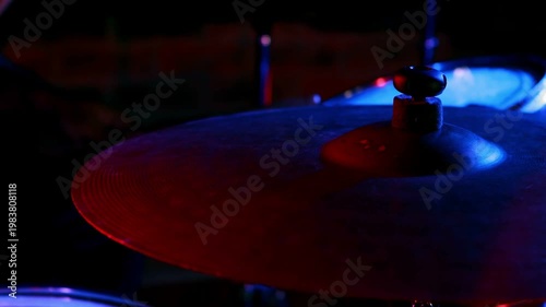 Yellow bolts appearing over cymbal as red or blue lights shifting, pulsing, accenting drums