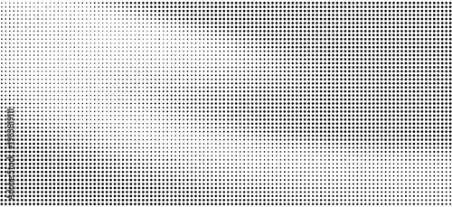 Halftone pattern with gradient effect in black and white dots on white background
