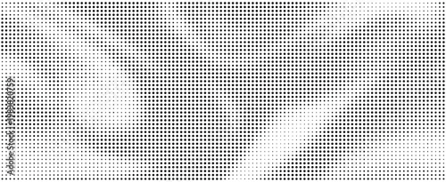 Halftone pattern with black dots on white background creating a gradient effect